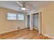 Bedroom featuring hardwood flooring, ceiling fan and a closet with folding doors at 3479 Chestnut Dr, Atlanta, GA 30340