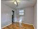 Bedroom with hardwood flooring, ceiling fan, neutral paint and a large window at 3479 Chestnut Dr, Atlanta, GA 30340