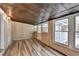 Sunroom featuring hardwood flooring, wood ceiling and lots of windows with a view at 3479 Chestnut Dr, Atlanta, GA 30340