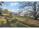 Spacious backyard with a large grassy area and mature trees at 3562 Ontario Ct, Buford, GA 30519