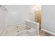 Relax in this spa-like bathroom, featuring a large soaking tub and a separate shower at 3562 Ontario Ct, Buford, GA 30519