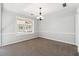 Cozy dining area with a chandelier and built-in window seat at 3562 Ontario Ct, Buford, GA 30519