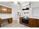 Eat-in kitchen with wood cabinets, ample counter space and new flooring at 3562 Ontario Ct, Buford, GA 30519