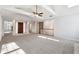 Open living room with high ceilings and neutral color palette at 3562 Ontario Ct, Buford, GA 30519