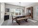 Bright dining room with farmhouse table, bench seating, and wood floors at 1874 Lucy Compton Nw Ln, Atlanta, GA 30318