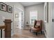 Upstairs hallway with a comfortable chair, natural light, and neutral decor at 1874 Lucy Compton Nw Ln, Atlanta, GA 30318