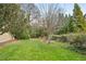 Well-maintained backyard features a lush lawn, mature trees, and privacy landscaping perfect for outdoor activities at 1 Brookhaven Ne Dr # 301, Atlanta, GA 30319