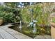 Zen Backyard garden featuring a heron sculpture fountain at 1 Brookhaven Ne Dr # 301, Atlanta, GA 30319