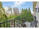 Private balcony overlooking a serene landscape with lush trees and manicured greenery at 1 Brookhaven Ne Dr # 301, Atlanta, GA 30319