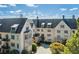Luxury condominium exterior showcasing detailed architecture, lush landscaping, and a prime location at 1 Brookhaven Ne Dr # 301, Atlanta, GA 30319