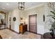 Welcoming foyer boasts elegant tile flooring, a decorative mirror, and a stylish entry door at 1 Brookhaven Ne Dr # 301, Atlanta, GA 30319