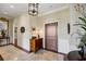 Inviting foyer featuring tiled floors, a wooden door, and decorative accents at 1 Brookhaven Ne Dr # 301, Atlanta, GA 30319