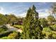 Lush front yard with mature trees and meticulously landscaped garden beds, creating an inviting entrance at 1 Brookhaven Ne Dr # 301, Atlanta, GA 30319