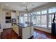 Well-lit kitchen showcases a center island, stainless steel appliances, and expansive windows at 1 Brookhaven Ne Dr # 301, Atlanta, GA 30319