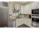 A bright kitchen features stone countertops, tile backsplash, and stainless steel appliances at 1 Brookhaven Ne Dr # 301, Atlanta, GA 30319