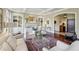 Elegant living room featuring a fireplace, built-in shelving, and an arched entryway at 1 Brookhaven Ne Dr # 301, Atlanta, GA 30319