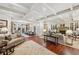 Open concept living room features hardwood floors, a fireplace, and elegant furnishings at 1 Brookhaven Ne Dr # 301, Atlanta, GA 30319