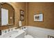 Charming powder room featuring a decorative mirror, vanity, and designer wallpaper at 1 Brookhaven Ne Dr # 301, Atlanta, GA 30319