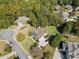Overhead shot of a property with lush greenery, a well-manicured lawn, and a charming home at 3420 Aviary Ln, Acworth, GA 30101