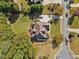 Bird's eye view of a home with well-kept grounds, set among mature trees and a quiet neighborhood at 3420 Aviary Ln, Acworth, GA 30101