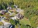 Scenic aerial perspective of a home nestled among mature trees and lush landscaping at 3420 Aviary Ln, Acworth, GA 30101