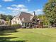 Beautiful backyard with a spacious deck, surrounded by lush greenery and mature trees at 3420 Aviary Ln, Acworth, GA 30101