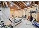 Unfinished basement with exposed ceiling and exercise equipment offers the perfect place to get fit at 3420 Aviary Ln, Acworth, GA 30101