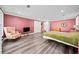 Bedroom featuring hardwood floors, sitting area, and neutral decor at 3420 Aviary Ln, Acworth, GA 30101