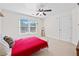 Bedroom featuring a ceiling fan and large window at 3420 Aviary Ln, Acworth, GA 30101