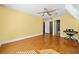 Bedroom features hardwood floors, a ceiling fan, and yellow walls at 3420 Aviary Ln, Acworth, GA 30101