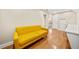 Versatile bonus room with a comfortable yellow sofa at 3420 Aviary Ln, Acworth, GA 30101