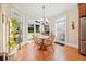 Cozy breakfast nook with hardwood floors and large windows overlooking a lush backyard at 3420 Aviary Ln, Acworth, GA 30101