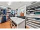 Walk-in closet with custom shelving and island, designed to maximize space and organization at 3420 Aviary Ln, Acworth, GA 30101