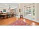 Elegant foyer features a dining area, hardwood floors, and a front door with sidelights at 3420 Aviary Ln, Acworth, GA 30101