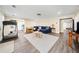 Open-concept living room with hardwood floors, modern furniture, and natural light at 3420 Aviary Ln, Acworth, GA 30101