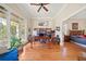 Bright living room with hardwood floors, a ceiling fan, and large windows for natural light and views at 3420 Aviary Ln, Acworth, GA 30101