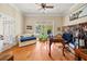 Bright office space with hardwood floors, large windows, and a comfortable sitting area with a couch at 3420 Aviary Ln, Acworth, GA 30101