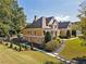 Spacious home featuring a combination of siding and brick, complemented by manicured landscaping at 3420 Aviary Ln, Acworth, GA 30101