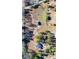 Bird's-eye view of rural land with a modern house, barn, and a circular driveway surrounded by green trees at 3625 Pointer Rd, Loganville, GA 30052