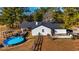 Aerial view of the backyard featuring a pool, patio, and well-maintained lawn, perfect for outdoor entertaining at 3625 Pointer Rd, Loganville, GA 30052