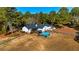 Aerial view of the backyard showcasing the pool, patio, and extensive yard space, ideal for recreation at 3625 Pointer Rd, Loganville, GA 30052