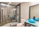 Bathroom with stone and glass walk-in shower, a vessel sink, and modern fixtures at 3625 Pointer Rd, Loganville, GA 30052