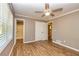 This bedroom features a ceiling fan, closet, and an ensuite bathroom at 3625 Pointer Rd, Loganville, GA 30052