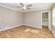Spacious bedroom features hardwood floors, ceiling fan, and ensuite bath with separate tub at 3625 Pointer Rd, Loganville, GA 30052