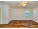 Large bedroom with wood-look floors and ceiling fan at 3625 Pointer Rd, Loganville, GA 30052