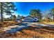 This home has a paved driveway and a white garage door at 3625 Pointer Rd, Loganville, GA 30052