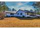 This home has a landscaped yard, black shutters, and a brick foundation at 3625 Pointer Rd, Loganville, GA 30052
