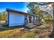 Charming home featuring a cozy front porch with rocking chairs and well-maintained landscaping at 3625 Pointer Rd, Loganville, GA 30052