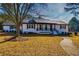 This charming home has a landscaped yard, black shutters, and a brick foundation at 3625 Pointer Rd, Loganville, GA 30052