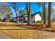 View of the home from the yard, showcasing the well-maintained lawn at 3625 Pointer Rd, Loganville, GA 30052